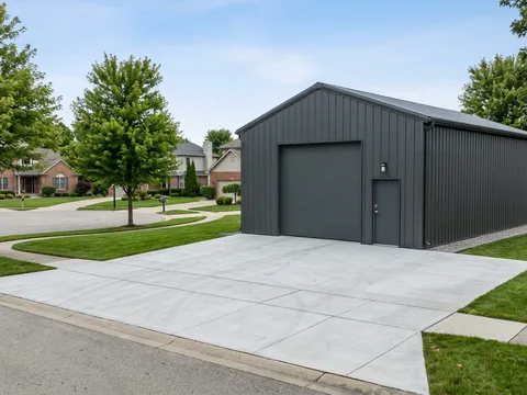 Steel garage or carport on a residential cul-de-sac with RV pad